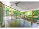 The screened porch offers outdoor living and wooded views at 11712 Black Horse Run, Raleigh, NC 27613