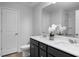 Bathroom featuring a double sink vanity with modern fixtures and a large mirror, offering a clean design at 18 Fairwinds Drive Dr, Lillington, NC 27546