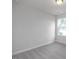 Comfortable bedroom with plush carpeting, neutral walls, and a bright window, perfect for relaxation at 18 Fairwinds Drive Dr, Lillington, NC 27546