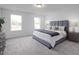 Spacious bedroom features large windows, a comfortable bed, and stylish decor at 18 Fairwinds Drive Dr, Lillington, NC 27546