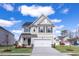 Charming two-story home with a manicured lawn, attached garage, and inviting entrance at 18 Fairwinds Drive Dr, Lillington, NC 27546