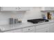 Close-up of the kitchen highlighting granite counters, updated appliances, and custom backsplash at 18 Fairwinds Drive Dr, Lillington, NC 27546