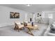 Upstairs living room with seating, a desk, and stylish decor at 18 Fairwinds Drive Dr, Lillington, NC 27546