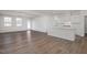 Open-concept living and kitchen area with wood floors and ample natural light at 18 Fairwinds Drive Dr, Lillington, NC 27546