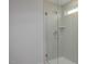 Contemporary glass shower enclosure with tiled walls and chrome fixtures, providing a spa-like experience at 18 Fairwinds Drive Dr, Lillington, NC 27546