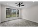Spacious bedroom with ceiling fan, neutral walls, and gray carpeting at 195 Daniel Ridge Ln, Roxboro, NC 27574