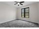Bright bedroom featuring gray carpet and a large window at 195 Daniel Ridge Ln, Roxboro, NC 27574