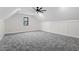 Spacious bonus room with grey carpet and white wainscoting at 195 Daniel Ridge Ln, Roxboro, NC 27574