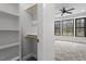 Spacious closet with shelves and hanging rod at 195 Daniel Ridge Ln, Roxboro, NC 27574