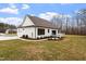 Rear view of house showing deck and landscaping at 195 Daniel Ridge Ln, Roxboro, NC 27574