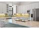 Modern kitchen with white cabinets, granite countertops, and green island at 195 Daniel Ridge Ln, Roxboro, NC 27574