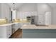 Modern kitchen with white cabinets, granite countertops, and green island at 195 Daniel Ridge Ln, Roxboro, NC 27574