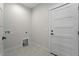 Laundry room with built-in cabinets and patterned tile floor at 195 Daniel Ridge Ln, Roxboro, NC 27574
