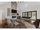 Virtually staged living room with comfy seating at 195 Daniel Ridge Ln, Roxboro, NC 27574