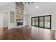 Living room with stone fireplace and hardwood floors at 195 Daniel Ridge Ln, Roxboro, NC 27574