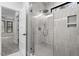 Walk-in shower with glass enclosure and gray tile at 195 Daniel Ridge Ln, Roxboro, NC 27574
