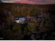 Aerial view of home near river at sunset at 196 Paces Mill Trl, Pittsboro, NC 27312