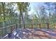 Spacious back deck with views of the surrounding trees, offering a great outdoor space for relaxation and entertainment at 196 Paces Mill Trl, Pittsboro, NC 27312