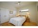 Cozy bedroom with a bed, two side tables, closet space, and natural light from window at 196 Paces Mill Trl, Pittsboro, NC 27312