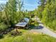 Charming home with lush greenery, long driveway and beautiful surroundings creating a peaceful retreat at 196 Paces Mill Trl, Pittsboro, NC 27312