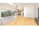 Open-concept living space with hardwood floors, leading into a modern kitchen and deck access at 196 Paces Mill Trl, Pittsboro, NC 27312