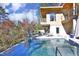 Backyard pool and sunbathing area near the house with an upper deck at 196 Paces Mill Trl, Pittsboro, NC 27312