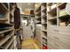 Spacious walk-in closet with custom shelving, drawers, and ample storage for clothes and accessories at 196 Paces Mill Trl, Pittsboro, NC 27312