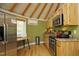 Small yurt kitchen with stainless steel appliances at 196 Paces Mill Trl, Pittsboro, NC 27312