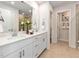 Elegant bathroom featuring double sinks, white quartz countertops, and neutral-toned flooring at 2015 Cherry Creek Rd, Haw River, NC 27258