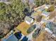 Property view showing the house, yard, and nearby buildings at 215 W Chestnut Ave, Wake Forest, NC 27587
