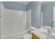 Clean bathroom with a tub shower, toilet and vanity at 215 W Chestnut Ave, Wake Forest, NC 27587