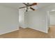 Bedroom with hardwood floors, ceiling fan and skylight at 215 W Chestnut Ave, Wake Forest, NC 27587