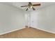Spacious bedroom with hardwood floors, ceiling fan, and walk-in closet at 215 W Chestnut Ave, Wake Forest, NC 27587