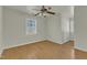 Well-lit bedroom with hardwood floors and a ceiling fan at 215 W Chestnut Ave, Wake Forest, NC 27587