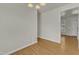 Bright dining room with hardwood floors and view into entryway at 215 W Chestnut Ave, Wake Forest, NC 27587
