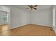 Bright living room with hardwood floors and ceiling fan at 215 W Chestnut Ave, Wake Forest, NC 27587