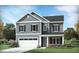 Two-story house with gray siding, white trim, and a two-car garage at 2224 Birdhouse Ln, Wake Forest, NC 27587