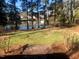 Large backyard with pond and mature trees at 223 Shalimar Dr, Durham, NC 27713