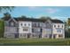 Modern 3-story townhome with light gray siding and a white trim at 2251 Horton Park Dr, Apex, NC 27539