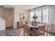 Modern dining area with round table and chairs near a hallway at 2253 Horton Park Dr, Apex, NC 27539