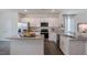 Island kitchen with granite countertops and stainless steel appliances at 2253 Horton Park Dr, Apex, NC 27539