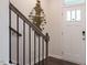 Entryway with staircase, dark hardwood floors, and modern wall art at 2255 Horton Park Dr, Apex, NC 27539