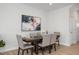 Dining area with a wood table and six gray upholstered chairs at 23 Village Edge Dr, Lillington, NC 27546