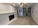 Gathering room with built-in shelving, fireplace, and hardwood floors at 2300 Radius Cir, Sanford, NC 27330