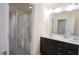 Bathroom boasts double sinks with modern fixtures and a shower-tub combo with a stylish curtain at 248 Begen St, Morrisville, NC 27560