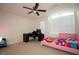 Bright bedroom with a pink bed frame, large window, and a desk for studying at 248 Begen St, Morrisville, NC 27560