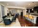 Open-concept living space featuring a dining area, kitchen island, and a comfortable lounge area at 248 Begen St, Morrisville, NC 27560