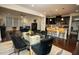 Open-concept living space featuring a dining area, kitchen island, and a comfortable lounge area at 248 Begen St, Morrisville, NC 27560