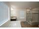 Bright bathroom with a soaking tub, walk-in shower, and dual-sink vanity at 248 Begen St, Morrisville, NC 27560