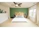 A spacious bedroom with a modern headboard and three windows at 248 Begen St, Morrisville, NC 27560